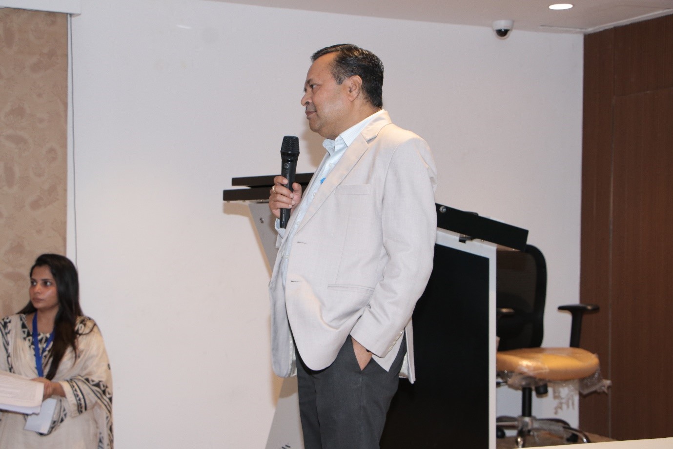 Expert discussing medicinal plant research and quality assurance